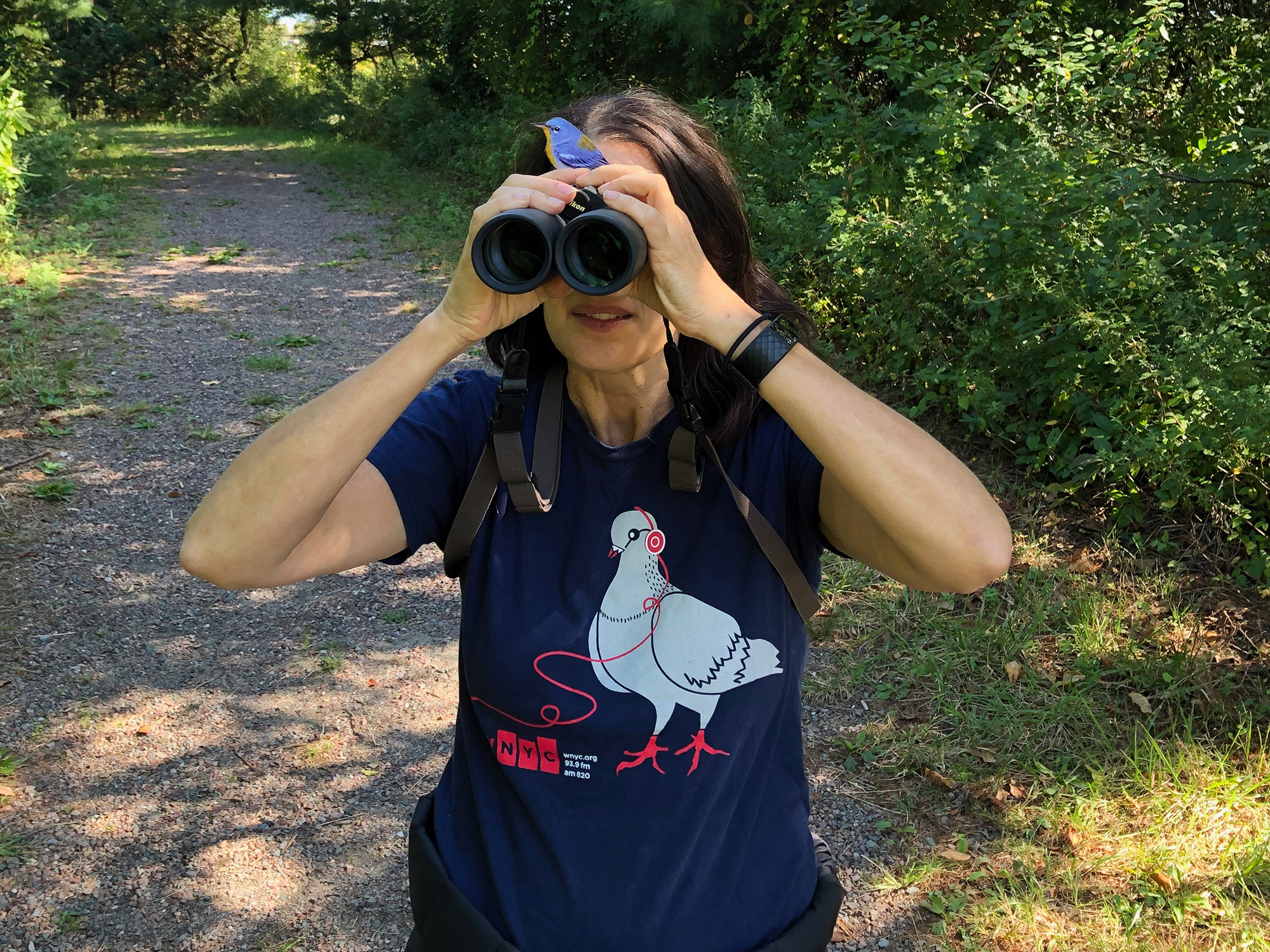 A photo of Carolyn Monastra with binoculars